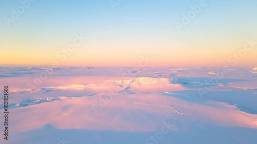 Frozen Arctic landscape with pastel sunset hues over vast icy plain