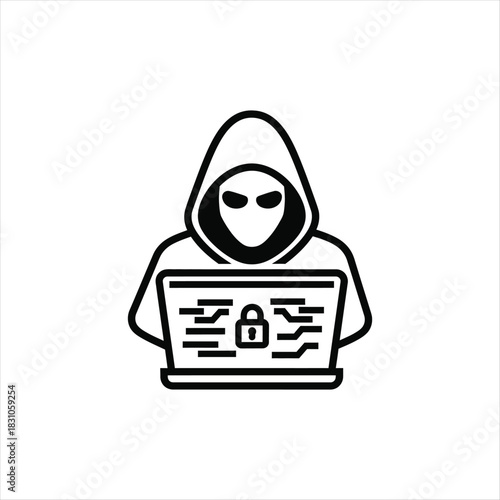 Silhouette of a hacker working on a laptop computer