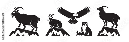 Silhouetted mountain animals including goats eagles and marmots standing on rocky peaks in black and white