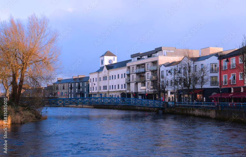 Naklejka premium Sligo city skyline over the Garavogue River in Connacht Province, Ireland, highlighting civic heritage and riverside atmosphere.