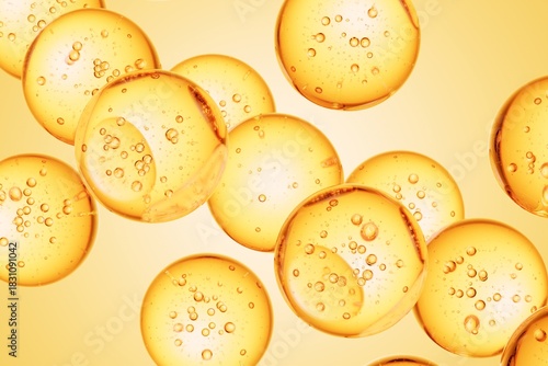 Golden liquid spheres containing suspended air bubbles, forming a smooth abstract background suitable for luxury skincare ads, wellness branding, and premium visuals