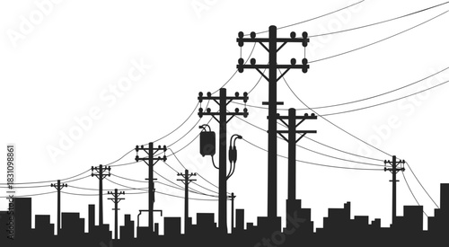 Silhouette of electricity poles and wires against a city skyline power transmission