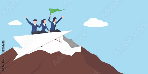 Team celebrates reaching mountain peak on paper airplane