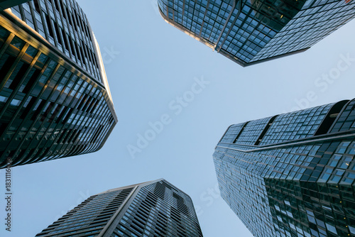 Low angle view of the Four Frankfurt skyscrapers against the blue sky 