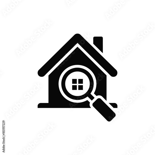 Magnifying glass focused on a house icon, representing home search or inspection.