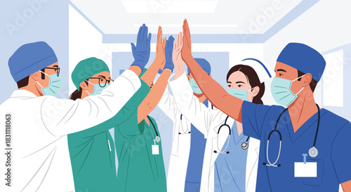 A diverse team of healthcare professionals, wearing medical masks and scrubs, high-fiving to celebrate teamwork and success in a hospital setting.