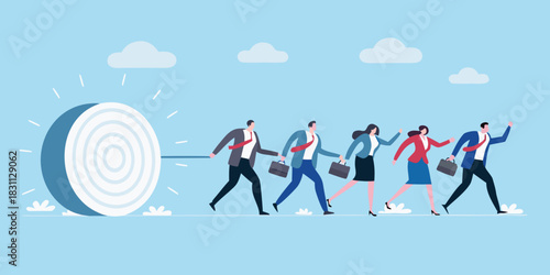 Business people pulling a large target towards success