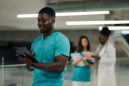 Medical professional using digital tablet for healthcare data