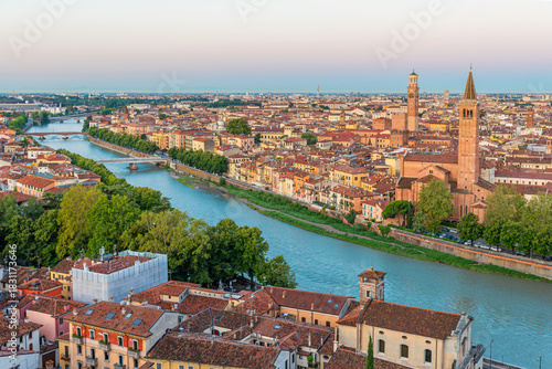 Fotografía Panoramic aerial view of Verona old town with Adige River, historic rooftops and church towers at sunset, Veneto, Italy