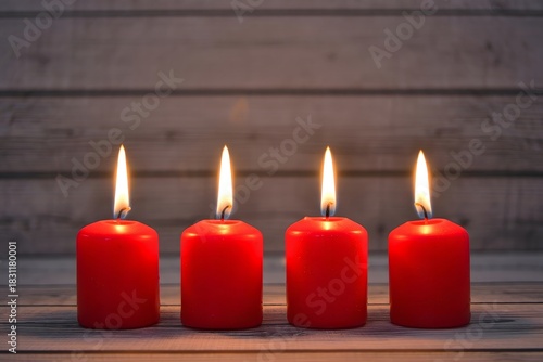 Four Red Candles Lit on Wooden Surface - Advent Season, Christmas, Hope