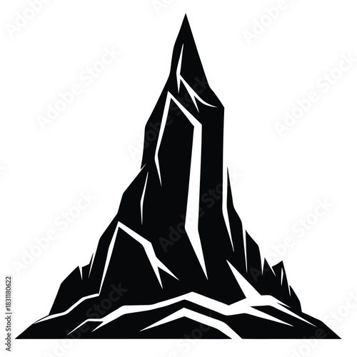 Stark silhouette of a monolithic peak exhibits a dramatic rocky landscape with rough ridges