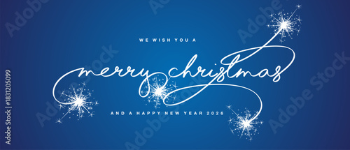 We wish you a Merry Christmas and a Happy New Year 2026. Merry Christmas white light handwritten lettering calligraphy on blue background. Merry Christmas text script calligraphy with sparkle firework