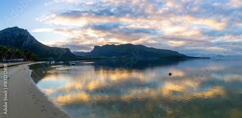 Le Morne Bay at sunrise with calm reflective waters, Mauritius