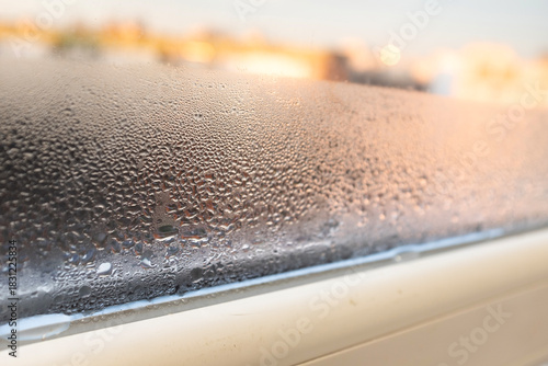 Condensation, mold, high humidity in the house. Foggy windows, humidity problem. high humidity in the house. hand wipes off water condensation from plastic window glass in the room 
