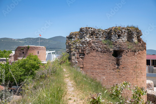 Fototapeta Naklejka Na Ścianę i Meble -  Iznik Castle gate, walls and water channel in Türkiye 2025 