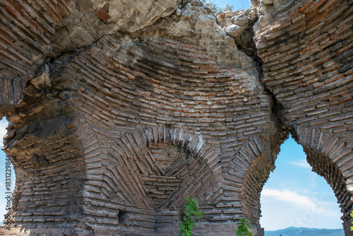 Fototapeta Naklejka Na Ścianę i Meble -  Iznik Castle gate, walls and water channel in Türkiye 2025 
