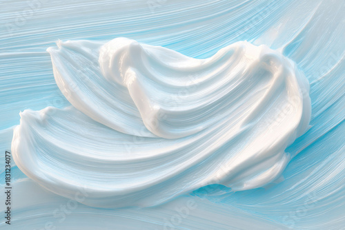Clinical skincare laboratory cream texture with smooth white moisturizer on blue background showing soft hydrating product for sensitive skin