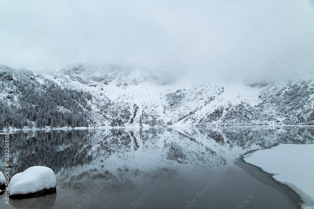 Fototapeta premium Morskie Oko Lake Covered in Ice at Winter in Tatra Mountains Poland.