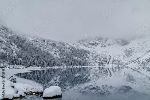 Fototapeta Naklejka Na Ścianę i Meble -  Morskie Oko Lake Covered in Ice at Winter in Tatra Mountains Poland.