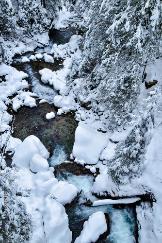 Tatra National Park in Poland.
Snowy winter landscape. Snow covered trees in forest.