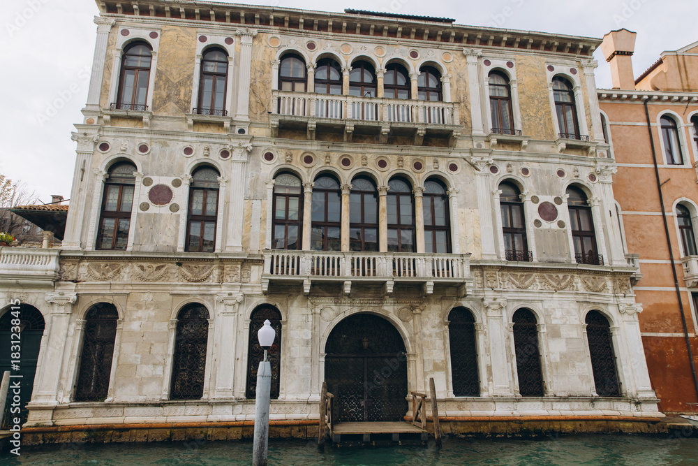 Fototapeta premium Venetian palazzo architecture standing along a canal in Venice