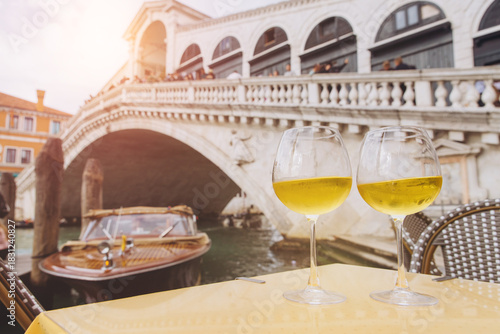 Celebrating Venice with wine glasses and Rialto Bridge