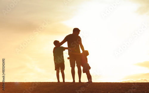 Father and Children Silhouette at Sunset