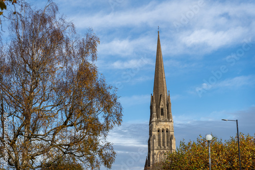 Church spire against autumn sky
