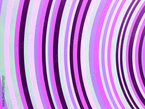 A view of neon colored curving stripes, as a background.