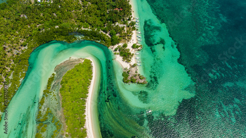 Top view of blue lagoon with islands in turquoise water. Tropical landscape. Balidbid Lagoon, Bantayan island, Philippines.