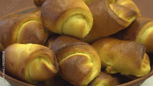buns in a rustic clay pot. national bakery product is a staple during Ukrainian national holiday celebrations.