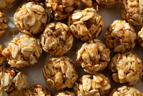 A top down view of a layer of granola balls, as a background.