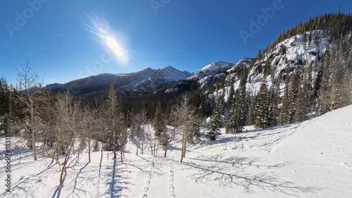 Rising up to view of Snow Rocky Mountains in Winter
