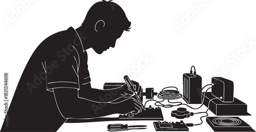 Silhouette of technician working on electronic circuit board