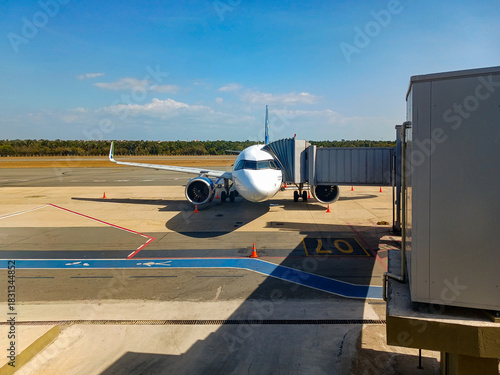 An aircraft next to the passenger bridge at São Luís Airport, MA, Brazil.