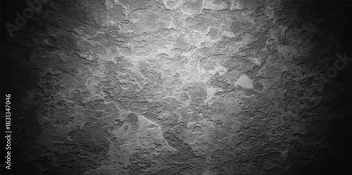 Grungy dark gray concrete wall texture with spotlight effect for backgrounds