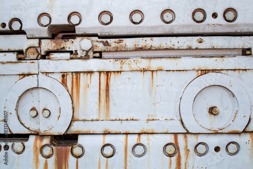 Large machine with rivets and rust spots