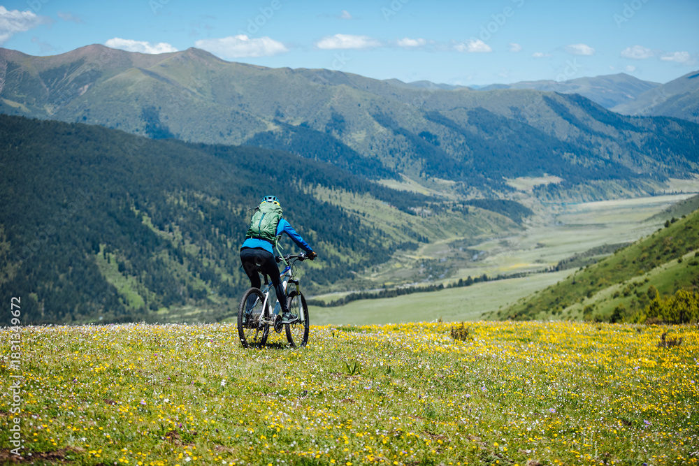 Obraz premium Riding mountain bike in the beautiful mountains