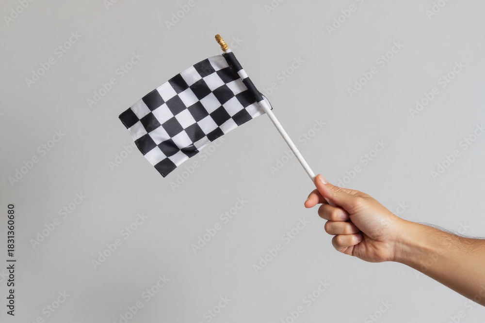 Obraz premium checkered race flag in hand.
