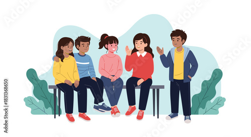 Five diverse young people are sitting and standing, talking and interacting happily in a casual outdoor setting.