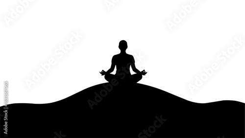 Silhouette of a person meditating in a serene pose on a hill.