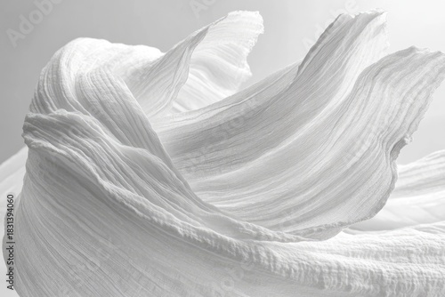 Delicate, flowing white fabric with airy, soft folds