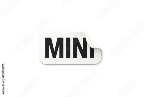 White sticker with mini text featuring a peeled corner