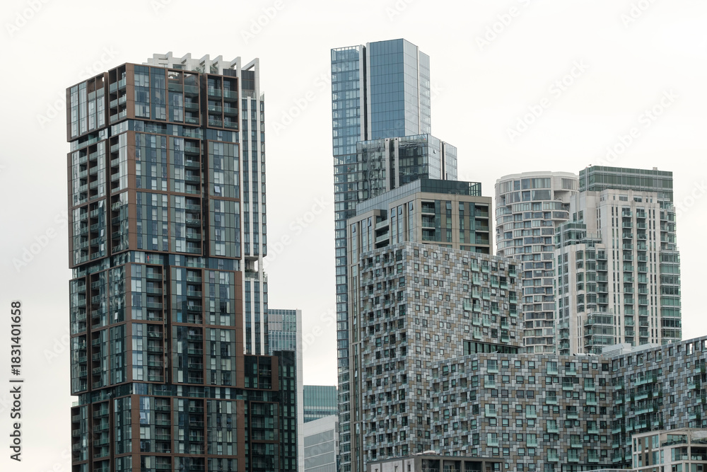 Obraz premium Modern residential skyscrapers dominating contemporary urban cityscape