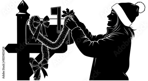 Silhouette of a woman in a Santa hat decorating a mailbox for Christmas.