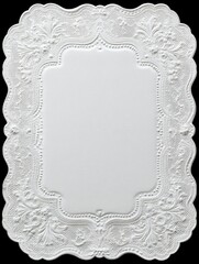 White oval lace doily with delicate elegant floral embroidery border on black background	