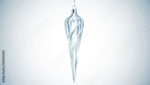 Elegant glass icicle ornament hanging against a soft gradient background for winter holiday decoration and festive seasonal design projects
