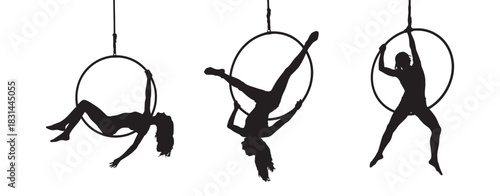 Silhouette of three women performing aerial hoop acrobatics, showcasing grace, strength, and flexibility in dynamic poses against a clean background.