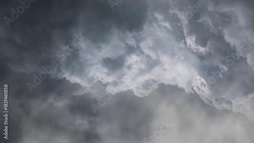 Dark Thunderstorm Clouds with Lightning Strikes in the Sky
