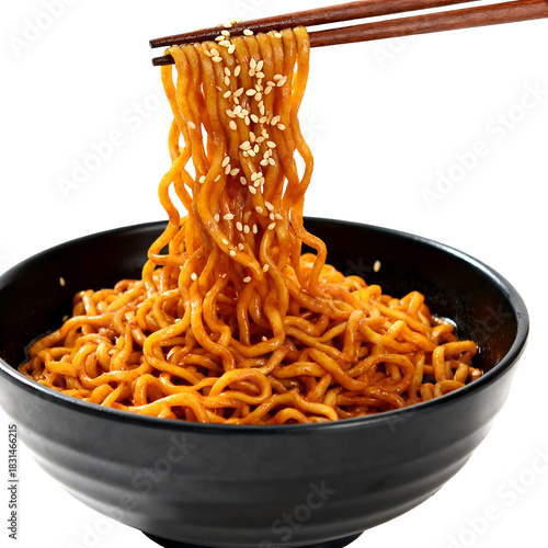 A close up view of red ramen noodles being lifted with chopsticks